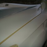 Before and after photographs of a damaged white, AUDI Quattro SUV that was repaired by Elite Paint & Body Shop in West Palm Beach, Florida.